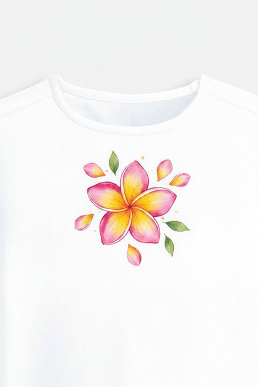 A white short-sleeve crop top t-shirt featuring a colorful watercolor-style plumeria flower graphic on the center chest, displayed against a light gray background.