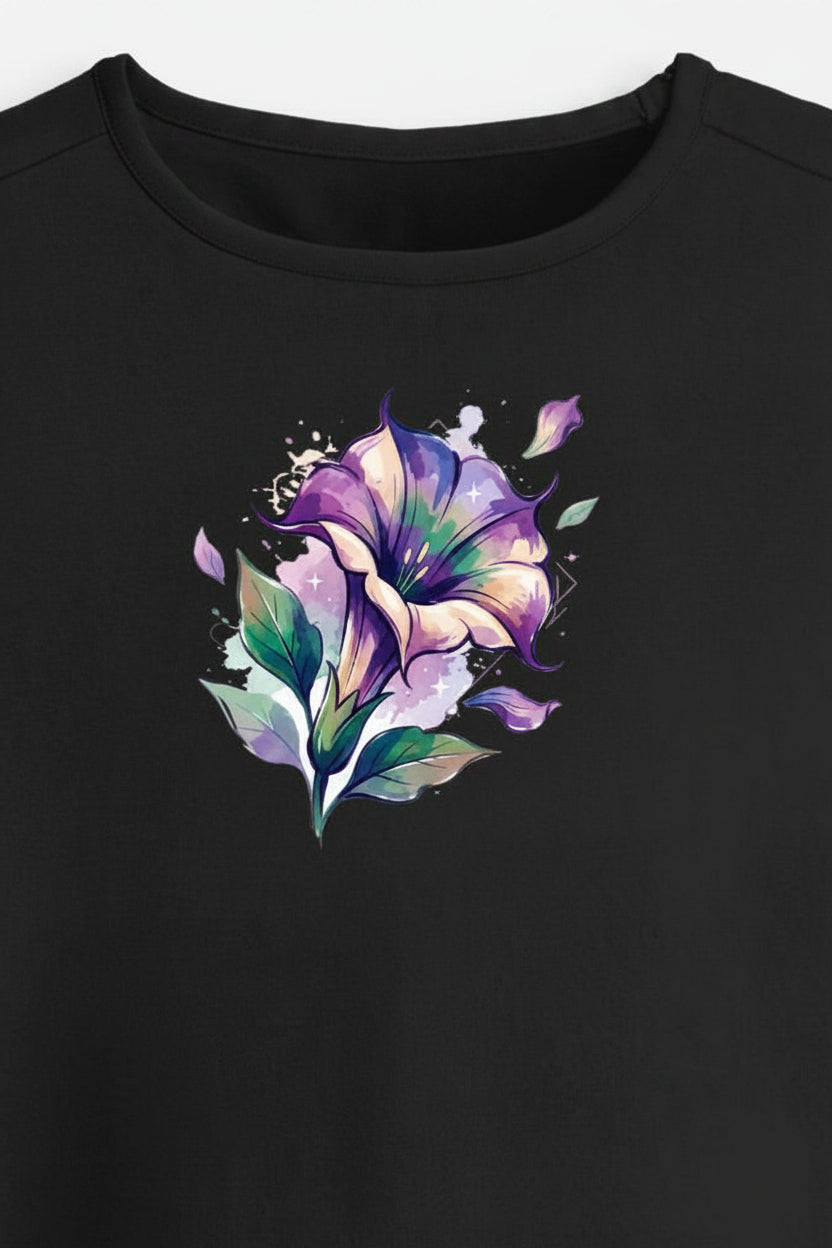 A black short-sleeve crop top t-shirt featuring a colorful watercolor-style floral graphic on the chest, displayed against a light gray background.